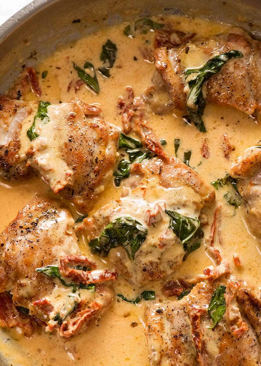 Chicken with Creamy Sun Dried Tomato Sauce in a silver pan, fresh off the stove ready to be served