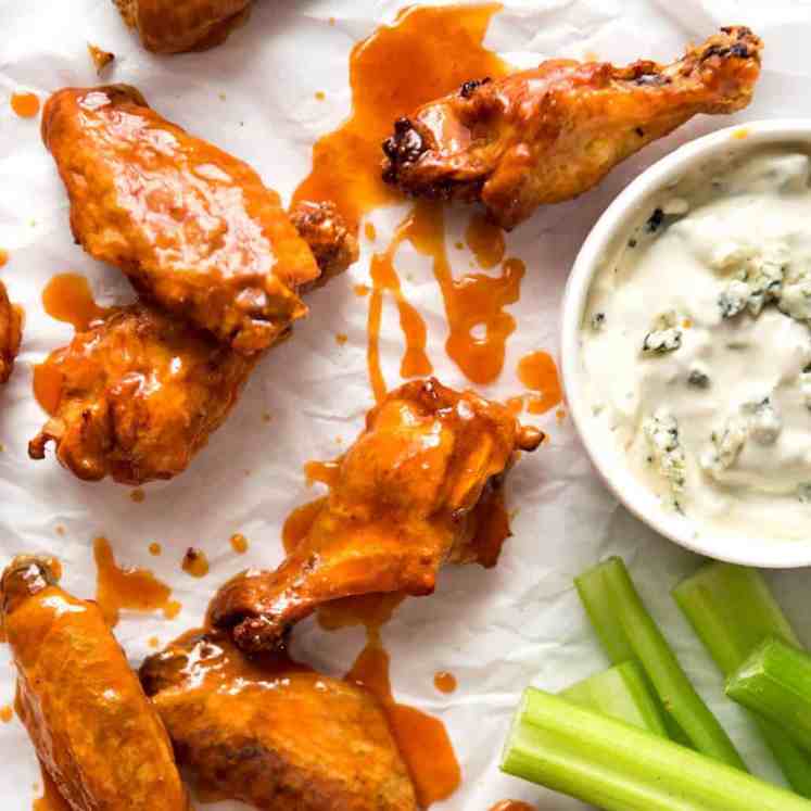 Truly Crispy Oven Baked Buffalo Wings - no false promises here, these wings are seriously crispy and unbelievably easy to make. Tossed in a classic Buffalo Sauce and served with blue cheese sauce. Watch the recipe video to HEAR just how crispy these are! recipetineats.com