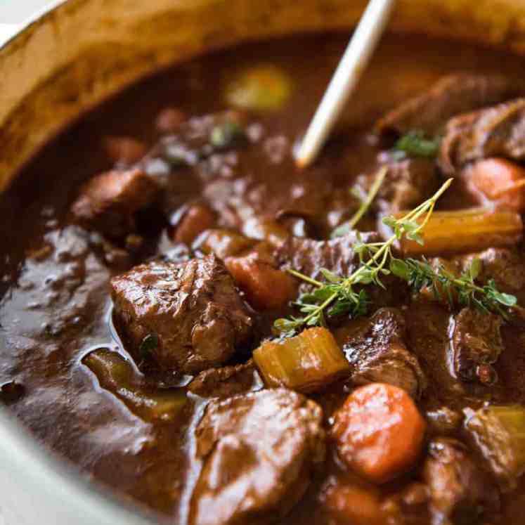 Irish Beef and Guinness Stew - The king of all stews! Fork tender beef in a rich thick sauce. Easy to make, just requires patience! Slow cooker, stove, oven and pressure cooker directions provided. www.recipetineats.com