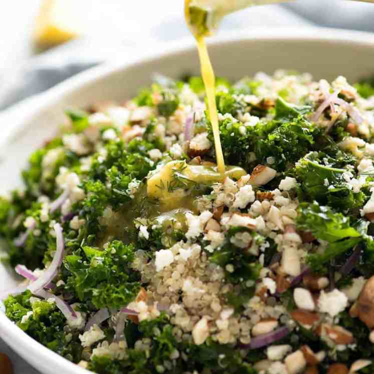 Pouring Lemon Dressing over Kale and Quinoa Salad