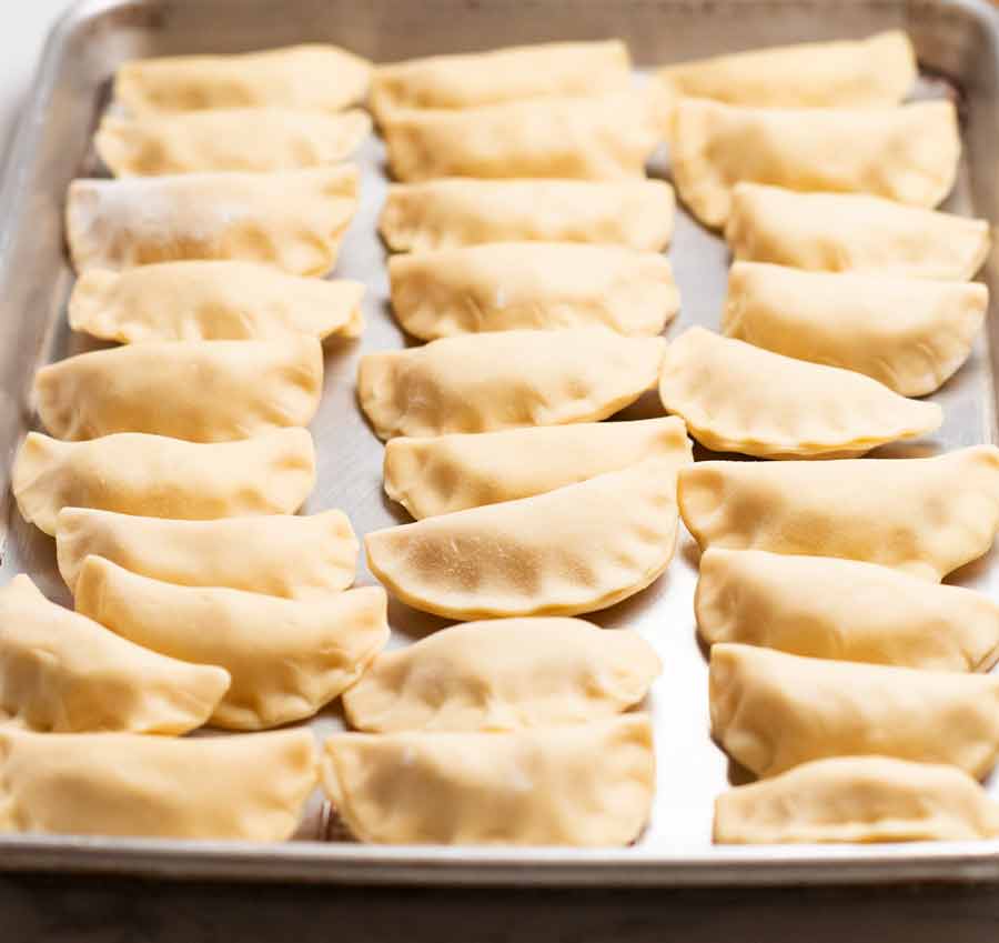 Tray of freshly made Pierogi Ruskie (Polish Dumplings) ready to cook