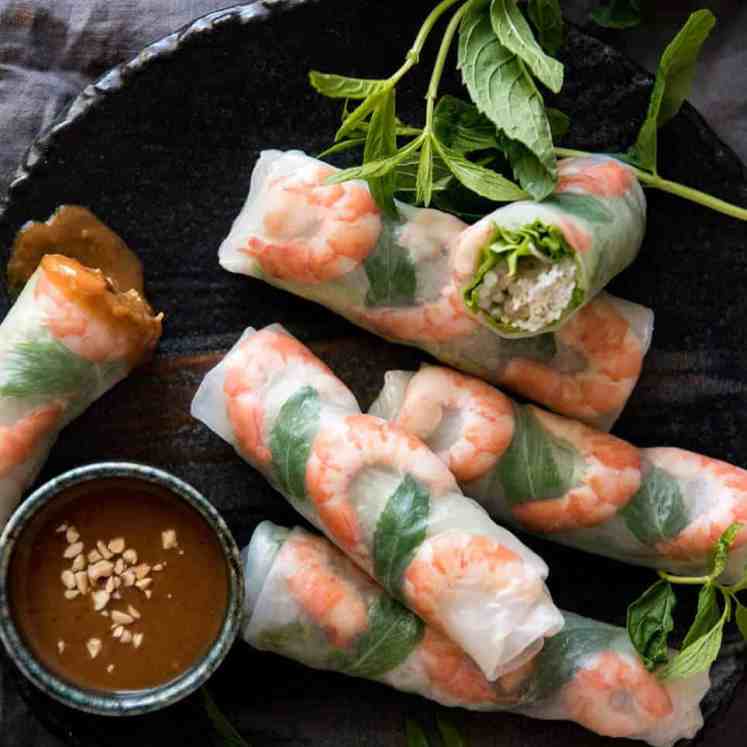 Jam packed with fresh, bright flavours, learn how to make Vietnamese Rice Paper Rolls with an easy to follow video tutorial and step by step photos. Served with an addictive Vietnamese Peanut Dipping Sauce! www.recipetineats.com
